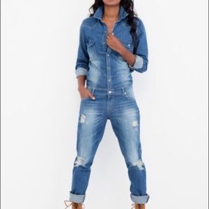 SIGNATURE 8 jean jumpsuit with distressed legs.